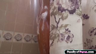 My stepsister looks at me while on her knees sucking my dick