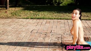 Luscious Latina beauty strips naked by the pool to expose big ass