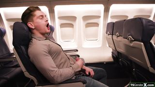 Busty shemale flight attendant Ariel Demure fucks passengers