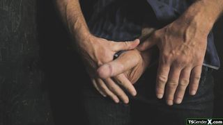 Trans babe is sucking a strangers cock through a gloryhole
